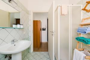 a bathroom with a sink and a mirror at Casa Rimedia in Solanas