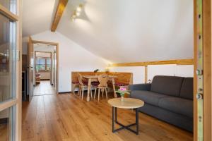 a living room with a couch and a table at Ferienwohnung am Teisenberg in Teisendorf