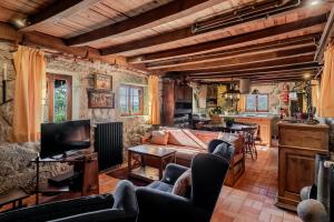 a living room with a couch and a table at Casa do Gerês in Geres