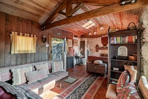 a living room with a couch and a table at Casa do Gerês in Geres
