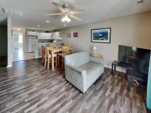 a living room with a couch and a table at Lazy Daze in Surf City
