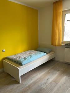 เตียงในห้องที่ Bei den Taunusbäumen