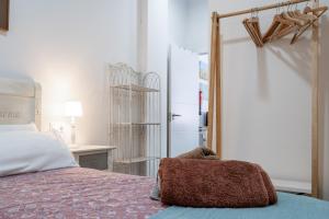 a bedroom with a bed with a stuffed animal on it at Apartamento Puertu Chicu in Llanes