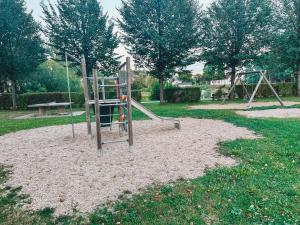 a playground with a slide in a park at Ferienwohnung am Reißberg in Plauen