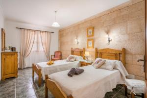 a bedroom with two beds in a room at Ca na Rossa in Campanet +18 photos