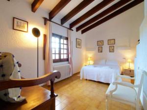 a bedroom with a white bed and a window at Cuixach villa in Pollensa with Wifi in Pollença
