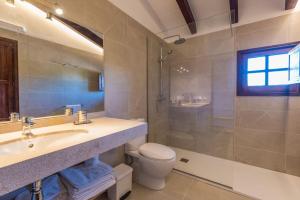 a bathroom with a sink and a toilet and a shower at Cuixach villa in Pollensa with Wifi in Pollença +25 photos