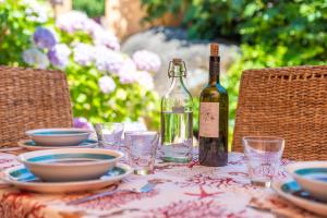 a bottle of wine sitting on top of a table at Vecchio Marino H4 in Palau