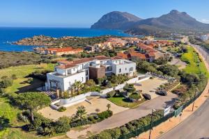 an aerial view of a villa with the ocean at Villa Marconi Apartment 7 in Golfo Aranci