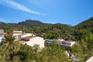 a view of a town with mountains in the background at Ca Na Bel in Port de Soller