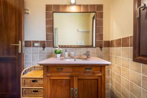 a bathroom with a sink and a mirror at villa Isabel 2 in Villasimius +30 photos