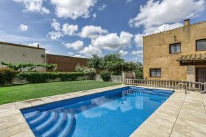 a swimming pool in the backyard of a house at Can Planas 1 in Fonolleras