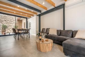 a living room with a couch and a table at Cas Suis 7 in Campanet