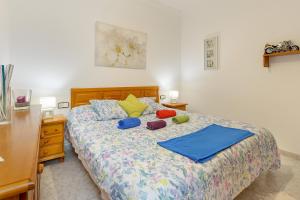 a bedroom with a bed with pillows on it at El Golfo Lanzarote in El Golfo
