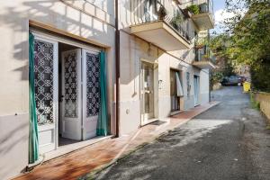 a building with a door on the side of a street at Goccia di mare with free parking in Levanto