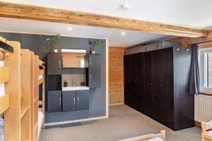 a room with a bunk bed and a closet at Feichtenhäusl app 2 in Westendorf