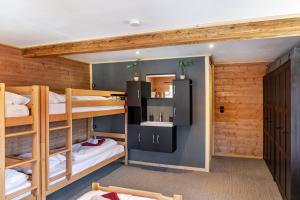 a room with two bunk beds and a sink at Feichtenhäusl app 2 in Westendorf