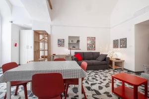 a living room with a table and chairs and a couch at Al Cornelio in Orvieto