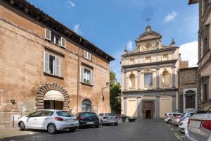 a group of cars parked in a street next to buildings at Al Cornelio in Orvieto