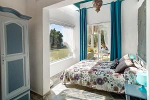 a bedroom with a bed and a window at Finca Fani 3 in Agüimes +21 photos