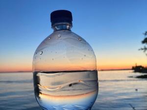 a bottle of water with the ocean in it at Stadler in Langenargen