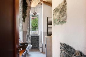 a hallway of a home with a window at Barcollo House - Piscina nel verde in Stella +24 photos