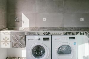 a laundry room with a washer and dryer at Casa Agua Nueva 53 in Frontera