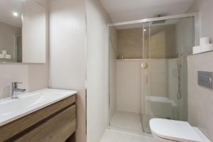 a bathroom with a shower and a toilet and a sink at Lujoso cerca de playa in Jávea +17 photos