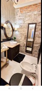 a bathroom with a sink and a mirror at The Cottage by the lake 1 in San Maurizio dʼOpaglio