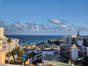 a view of a city with the ocean in the background at BlumLuxury Apartment in San Bartolomé