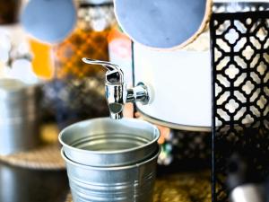 a mixer sitting on top of a tin on a counter at Anchor Boutique House in Patong Beach +44 photos