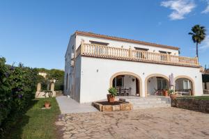 a large white house with a balcony on top at Paulina in Jávea