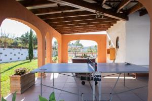 a ping pong table in the middle of a patio at Paulina in Jávea