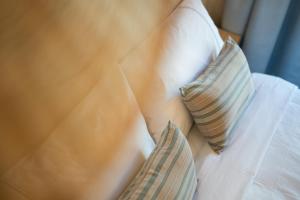 a close up of two pillows on a bed at Das Carretas in Madrid