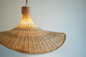 a wicker light fixture hanging from a ceiling at Das Carretas in Madrid +69 photos