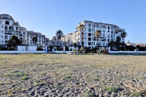 a view of a beach with buildings in the background at Marina de la Duquesa 805 in Manilva