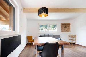 a dining room with a table and chairs at Haus Mader 1 in Riscone