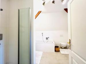 a bathroom with a shower and a toilet at Traum-ferienwohnung in Siegsdorf +16 photos