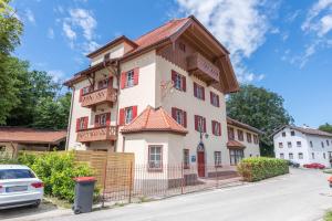 a large building with a fence in front of it at Traum-ferienwohnung in Siegsdorf