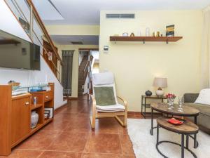a living room with a couch and a table at Apartment Coco Golf by Interhome in Sant Jordi