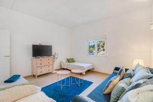 a living room with a couch and a tv at La Casa del Caballo in Adeje