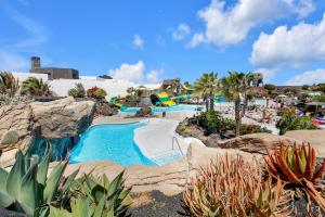 a resort with a pool and a water park at Sweet Home Majanicho in Majanicho