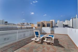two chairs on the roof of a building at Casa Paula - 25 in Arinaga