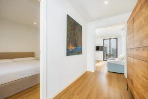 a bedroom with a bed and a painting on the wall at Ca Na Tonina Ref 7000 in S'Illot