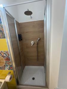 a shower with a glass door in a bathroom at Casa Concordia in Agrigento +21 photos