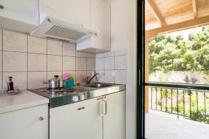 a kitchen with a sink and a counter top at Vardia studio A in Mikros Gialos