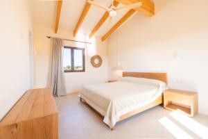 a white bedroom with a bed and a window at Villa Lorena in Islas Baleares +22 photos