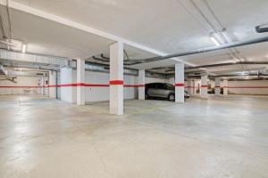 an empty parking garage with a car parked in it at Albalat Tarongers in Albalat de Taronchers