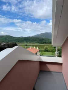 a view from the balcony of a house with mountains at Villa Gioia sui colli Euganei in Torreglia