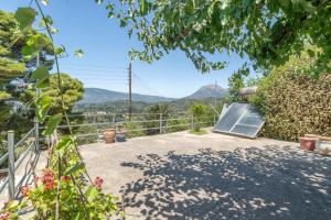 a patio with a view of the mountains at Zoe apartment in Marantochori
